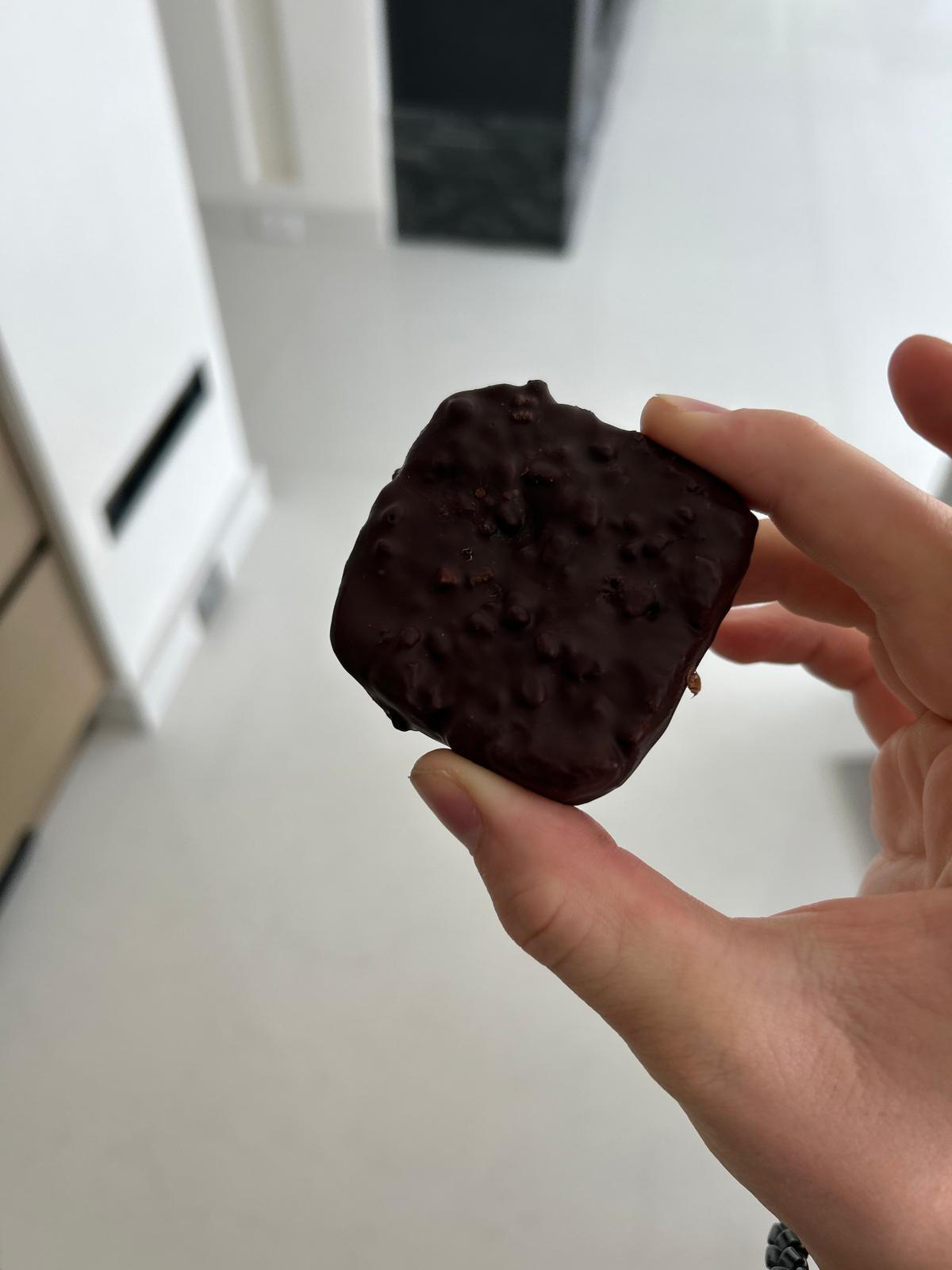 Close-up of the actual square Gut Freak chocolate bar